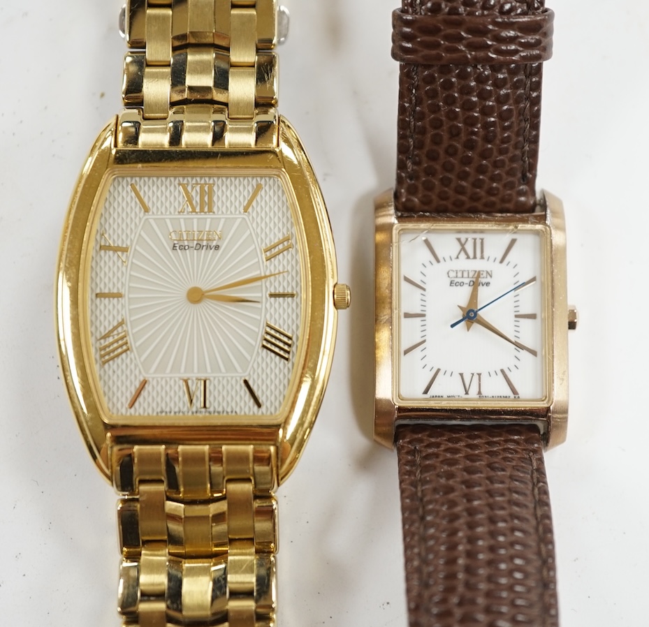 A gentleman's recent gilt metal Citizen Eco-Drive wrist watch and one other Citizen watch. Condition - poor to fair